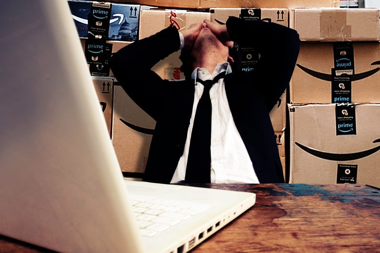 A man looks beleaguered in front of a laptop with Amazon boxes behind him.